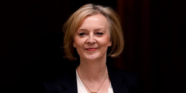 British Prime Minister Liz Truss leaves 10 Downing Street to attend a session of Parliament in London, Wednesday, Oct. 19, 2022.