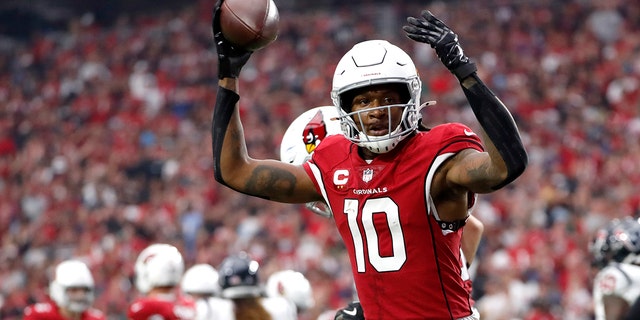 DeAndre Hopkins, #10 of the Arizona Cardinals, celebrates after scoring a touchdown in the second quarter against the Houston Texans in the game at State Farm Stadium on Oct. 24, 2021 in Glendale, Arizona.