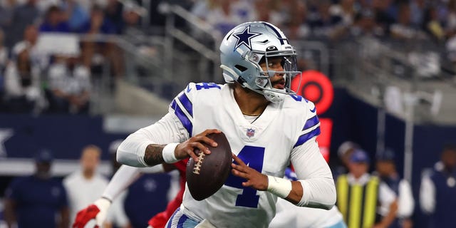 Dak Prescott of the Dallas Cowboys carries the ball against the Tampa Bay Buccaneers during the second half Sept. 11, 2022, in Arlington, Texas. 