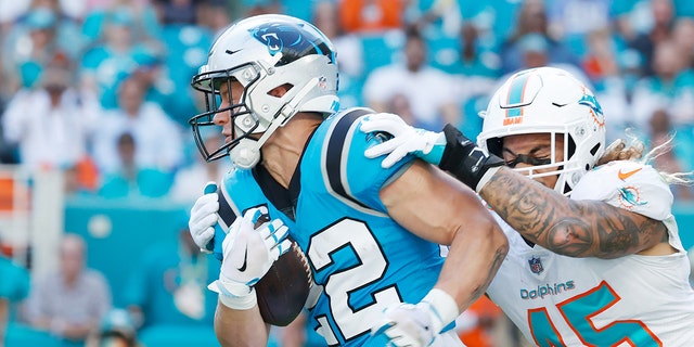 Christian McCaffrey #22 of the Carolina Panthers during their game against the Miami Dolphins at Hard Rock Stadium on November 28, 2021, in Miami Gardens, Florida.