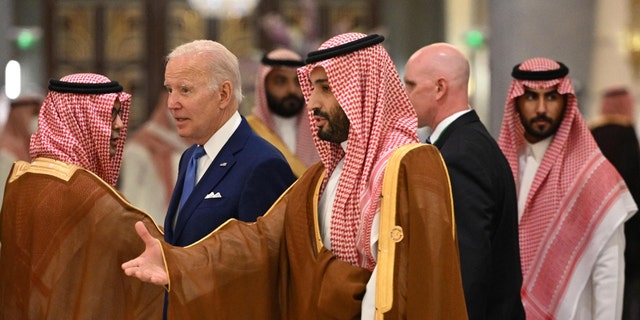 TOPSHOT - US President Joe Biden (C-L) and Saudi Crown Prince Mohammed bin Salman (C) arrive for the family photo during the Jeddah Security and Development Summit (GCC+3) at a hotel in Saudi Arabia's Red Sea coastal city of Jeddah on July 16, 2022. 