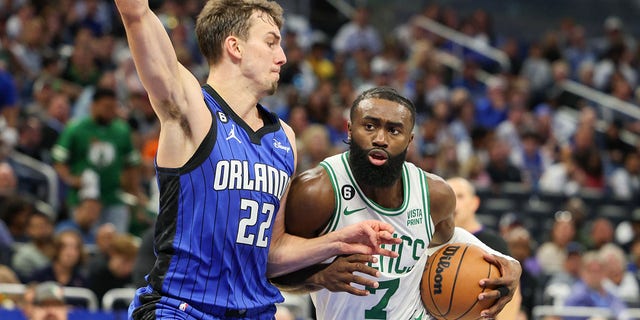 Boston Celtics guard Jaylen Brown (7) drives to the basket defended by Orlando Magic forward Franz Wagner (22) in the second quarter at Amway Center in Orlando, Fla., Oct 22, 2022.