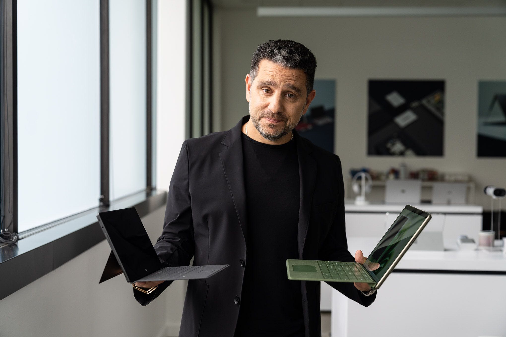 A photo of Microsoft executive Panos Panay holding the Surface Pro 9.