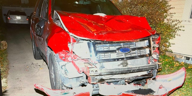 Extensive front-end damage shown on the red Ford Escape SUV Waukesha Christmas parade suspect Darrell Brooks allegedly used to mow down celebrants last year. Jurors were allowed to view the van at the courthouse.