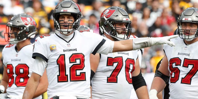 Tampa Bay Buccaneers quarterback Tom Brady (12) signals a penalty against the Pittsburgh Steelers during the fourth quarter at Acrisure Stadium in Pittsburgh Oct. 16, 2022.