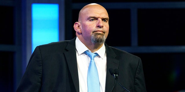 Pennsylvania Senate Democratic candidate John Fetterman participates in a debate with GOP challenger Dr. Mehmet Oz in Harrisburg, Pennsylvania, on Tuesday.