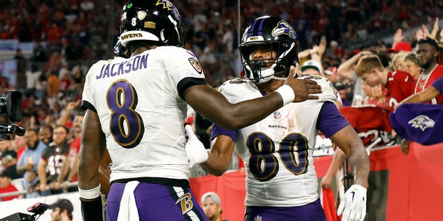 Isaiah Likely #80 of the Baltimore Ravens celebrates his touchdown with teammate Lamar Jackson #8 during the third quarter against the Tampa Bay Buccaneers at Raymond James Stadium on October 27, 2022 in Tampa, Florida.