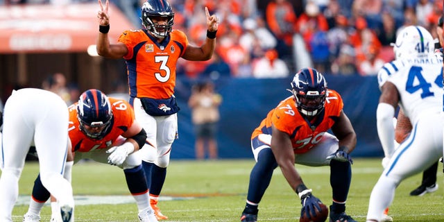 Denver Broncos quarterback Russell Wilson signals to his team during the game against the Indianapolis Colts at Empower Field at Mile High in Denver, Colorado, on Oct. 6, 2022.