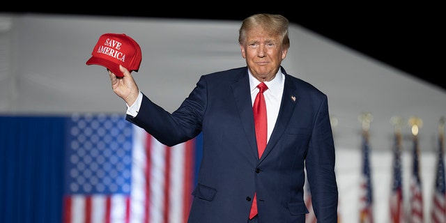 Former President Donald Trump makes his entrance at a rally at the Minden Tahoe Airport in Minden, Nevada, on Oct. 8, 2022.