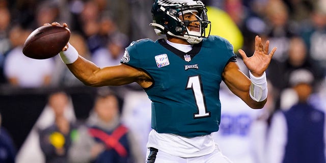 Philadelphia Eagles' Jalen Hurts looks to pass during the first half of an NFL football game against the Dallas Cowboys on Sunday, Oct. 16, 2022, in Philadelphia. 