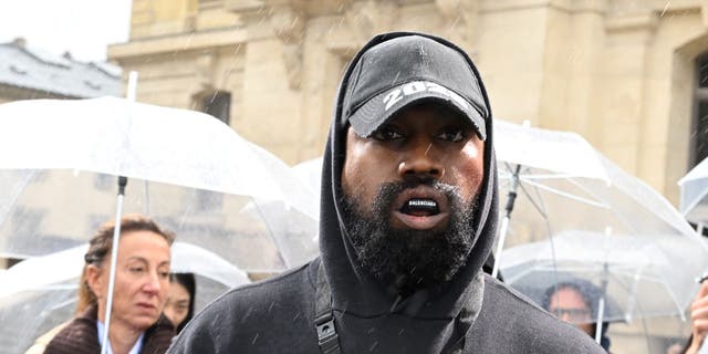 Kanye West attends the Givenchy Women's Spring/Summer show during Paris Fashion Week on Oct. 2, 2022.