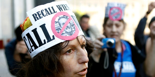 Nudist Gypsy Taub speaks with reporters after removing her clothing at the U.S. Courthouse in San Francisco, California Jan. 17, 2013. Nudists gathered prior to a hearing on a lawsuit seeking to block implementation of San Francisco's ban on public nudity. 