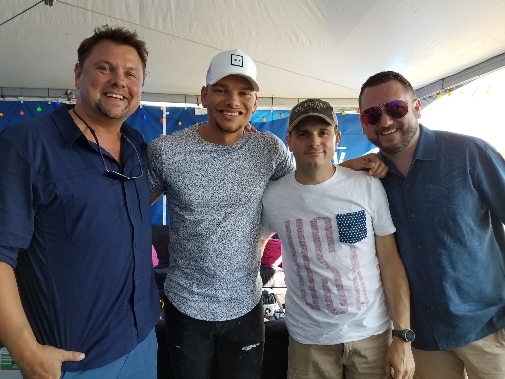 SiriusXM hosts Storme Warren, Al Skop and former SiriusXM country music executive J.R. Schumann pose for a photo after an interview with country superstar Kane Brown on Oct. 1, 2017 - hours before bloodshed was unleashed on the Route 91 Harvest Festival in Las Vegas.