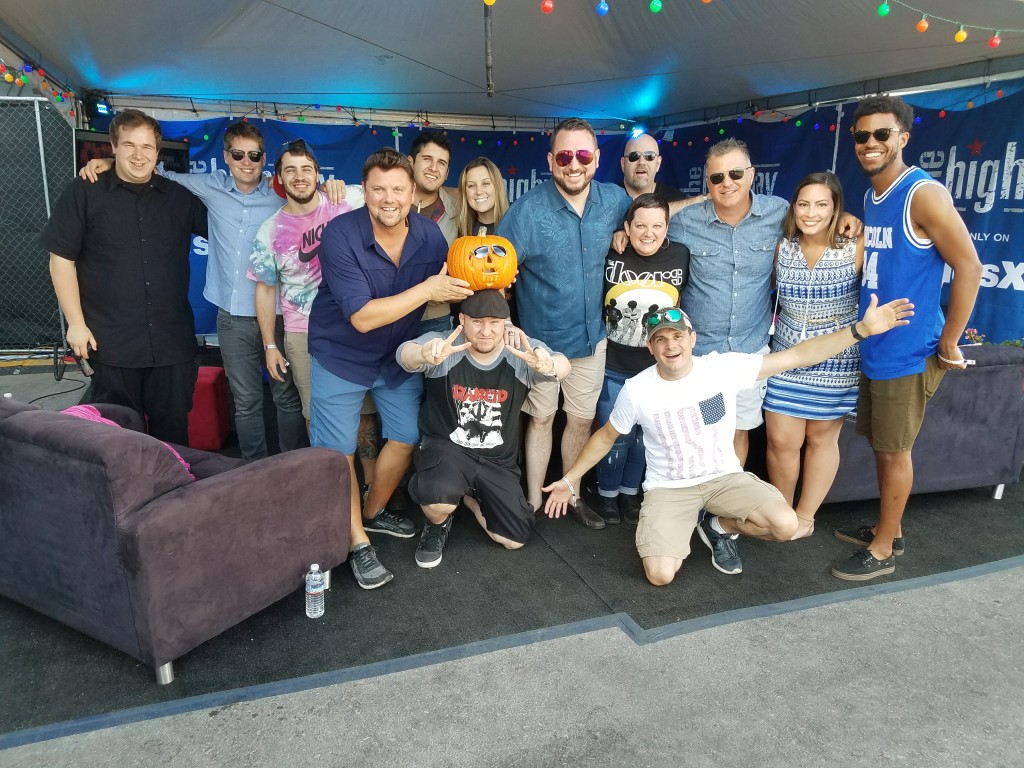 The crew from SiriusXM poses for a photo during the Route 91 Harvest Festival in Las Vegas. This crew worked in this setup behind the mainstage for three days in the grueling Vegas heat. This crew also survived the worst mass shooting in US history.