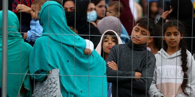 Evacuees from Afghanistan are seen at their temporary shelter inside the US Army Rhine Ordonanz Barracks in Kaiserslautern, Germany, August 30, 2021. REUTERS/Kai Pfaffenbach