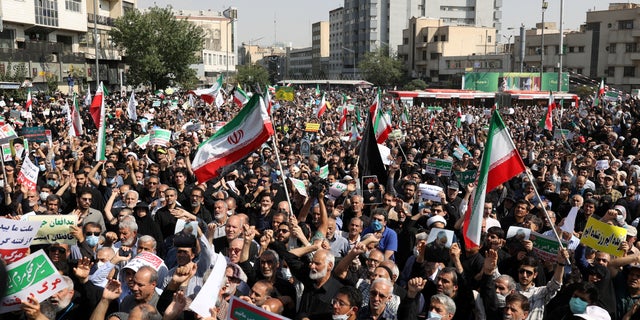 Pro-government peoples rally against the recent protest gatherings in Iran, after the Friday prayer ceremony in Tehran, Iran September 23, 2022. Iranians have staged mass protests over the case of Mahsa Amini, 22, who died last week after being arrested by the morality police for wearing "unsuitable attire".