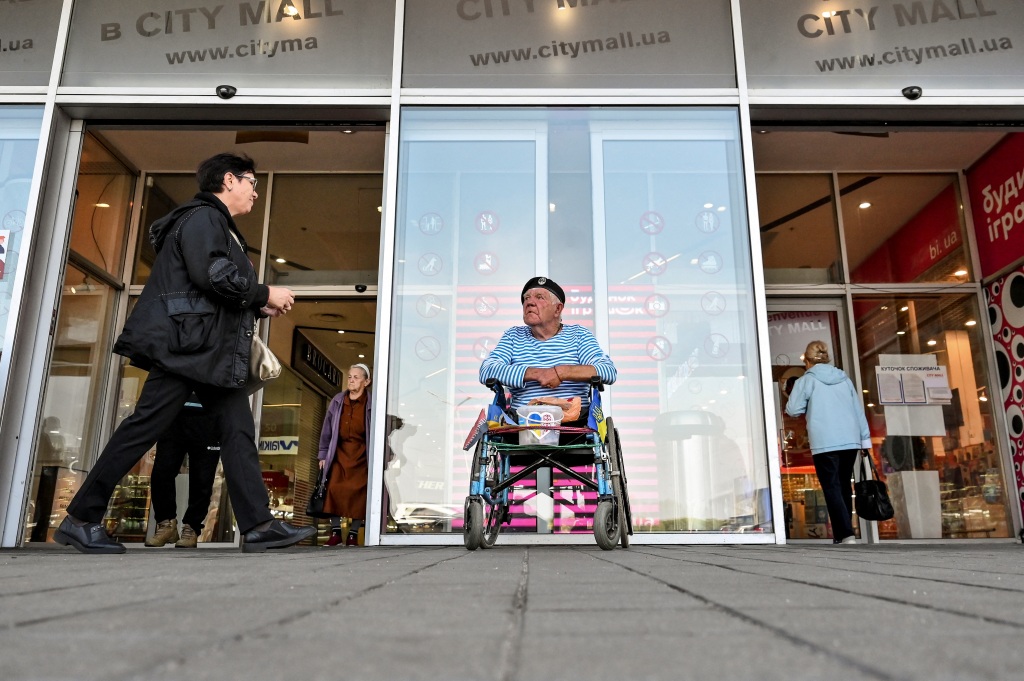 Hryhorii Yanchenko, a Soviet army veteran who fled to Zaporizhzhia from Russian controlled Kherson city, collects donations for the Ukrainian Armed Forces amid Russia's attack on Ukraine, in Zaporizhzhia, Ukraine on Sept. 29, 2022.