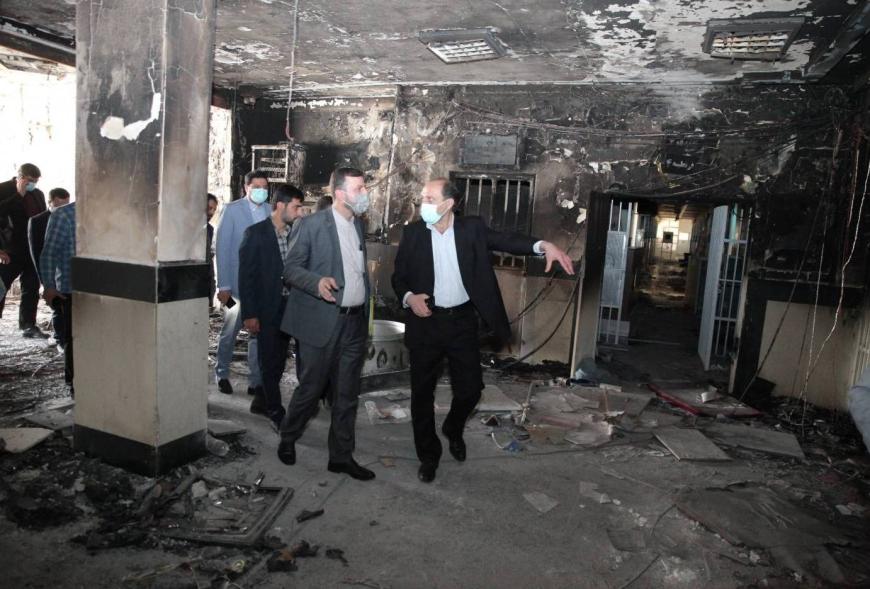 Head of Iran's Human Rights Headquarters and Deputy Chief of the judiciary Kazem Qaribabadi (left) visit Evin Prison after the damage.