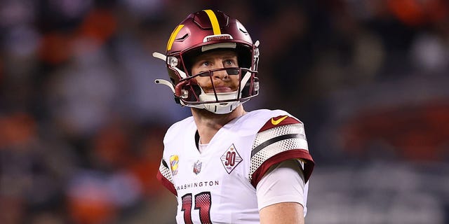 Carson Wentz of the Washington Commanders reacts against the Chicago Bears at Soldier Field on Oct. 13, 2022, in Chicago.