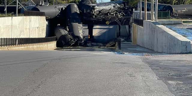 Multiple cars of a Norfolk Southern freight train derailed on a bridge about a half-mile east of an Amtrak station in Ohio.