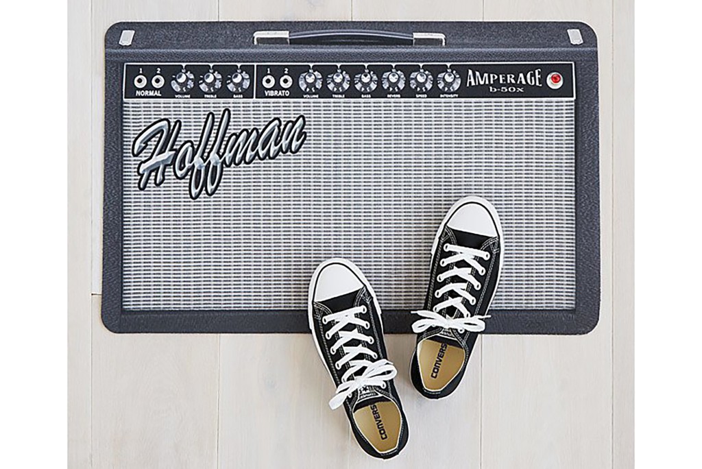 A doormat shaped like an amp with the name Hoffman on it in Fender font 