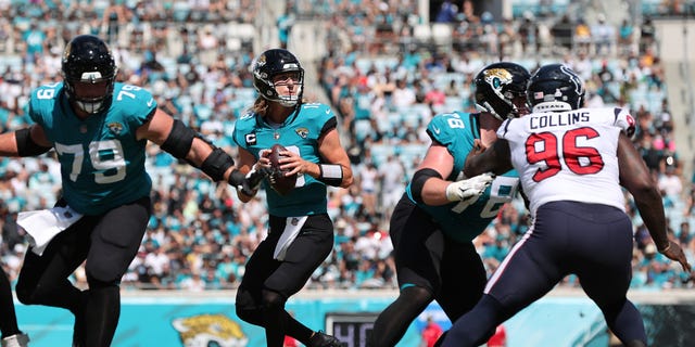 Trevor Lawrence #16 of the Jacksonville Jaguars looks to pass the ball during the second half of the game against the Houston Texans at TIAA Bank Field on October 09, 2022 in Jacksonville, Florida.