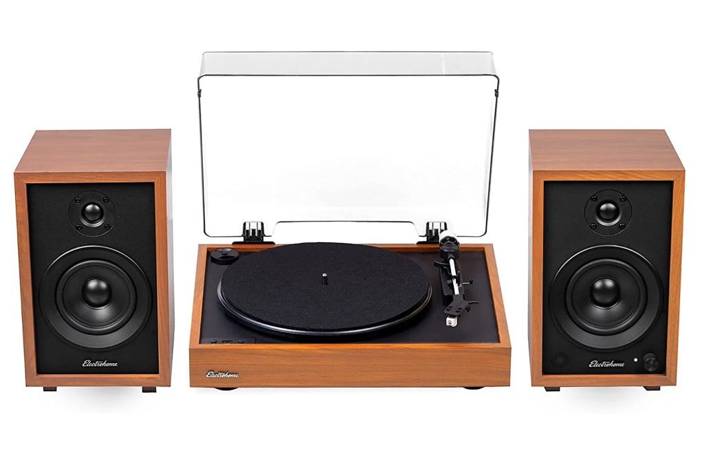 A record player and two bluetooth speakers