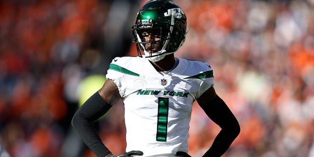 Sauce Gardner #1 of the New York Jets looks on during an NFL football game between the Denver Broncos and the New York Jets at Empower Field At Mile High on October 23, 2022 in Denver, Colorado.