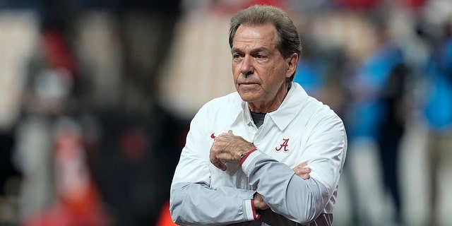 Alabama head coach Nick Saban watches warm ups before the College Football Playoff championship football game against Georgia Monday, Jan. 10, 2022, in Indianapolis.