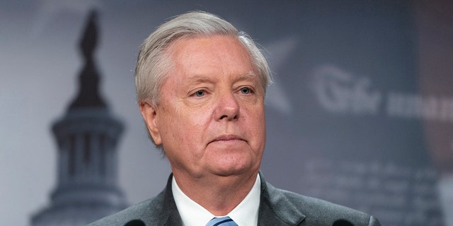 Sen. Lindsey Graham, R-S.C., speaks with reporters about aid to Ukraine on Capitol Hill March 10, 2022, in Washington.