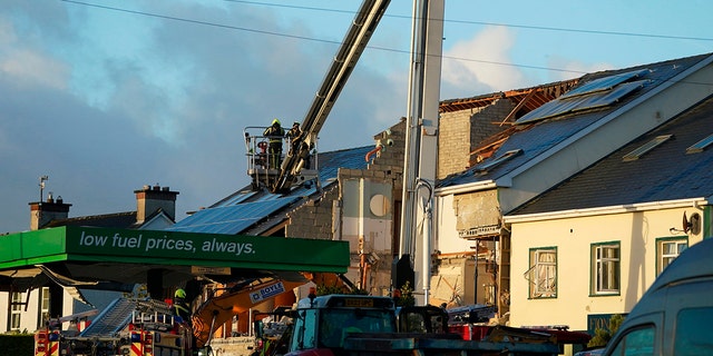 Emergency services work at the scene of an explosion at Applegreen service station in the village of Creeslough in Co Donegal, Ireland, Saturday, Oct. 8, 2022. 