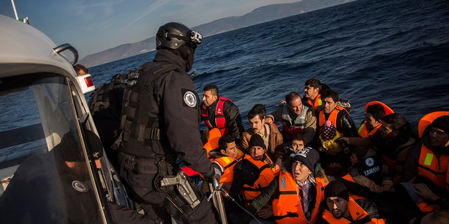 Members of the Frontex, European Border Protection Agency, from Portugal rescue 56 people, who were lost in an open sea as they try to approach on a dinghy the Greek island of Lesbos, on Dec. 8, 2015. 