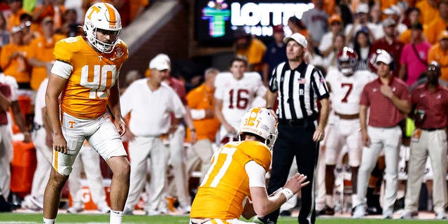 Tennessee place kicker Chase McGrath (40) readies to kick a last-second field goal as holder Paxton Brooks (37) waits to snap during the second half of an NCAA college football game against Alabama Saturday, Oct. 15, 2022, in Knoxville, Tenn. Tennessee won 52-49. 