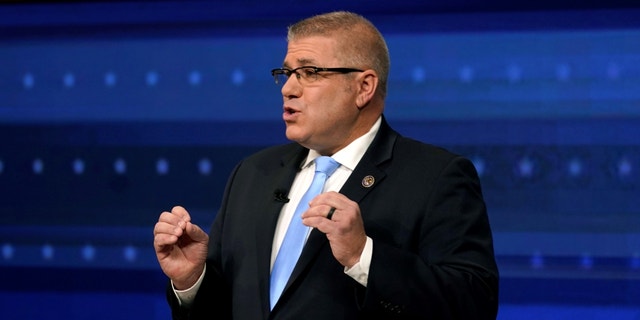 Republican gubernatorial challenger state Sen. Darren Bailey gestures during Tuesday's debate with Illinois Gov. JB Pritzker.