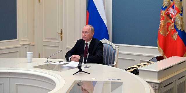 Russian President Vladimir Putin watches a training to test the strategic deterrence forces via videoconference in Moscow Oct. 26, 2022. 