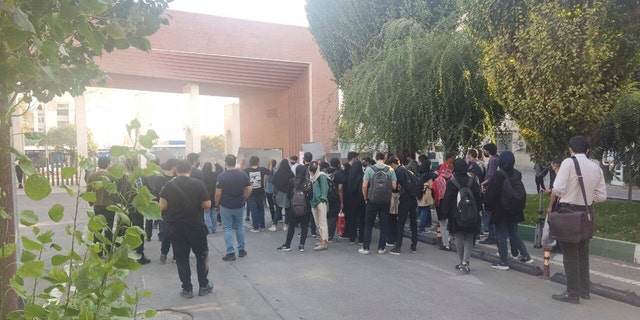 In this photo taken by an individual not employed by the Associated Press and obtained by the AP outside Iran shows students of the Sharif University of Technology attend a protest sparked by the death in September of 22-year-old Mahsa Amini in the custody of the country's morality police, in Tehran, Friday, Oct. 7, 2022. 