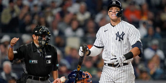 New York Yankees Aaron Judge reacts after striking out against the Houston Astros during the fourth inning of Game 3 of an American League Championship baseball series, Saturday, Oct. 22, 2022, in New York.