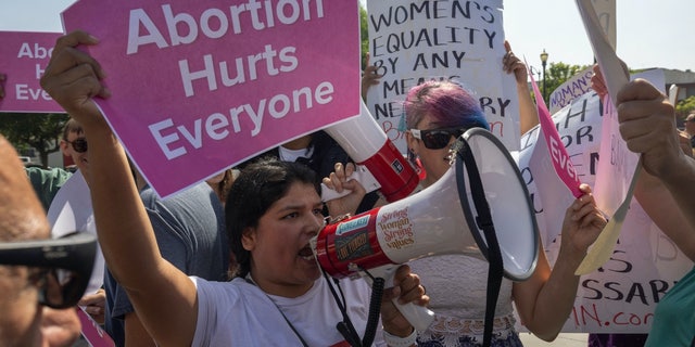 Pro-life protesters at the Women's March Action Rally for Reproductive Rights at Mariachi Plaza in Los Angeles, California, on Oct. 8, 2022.