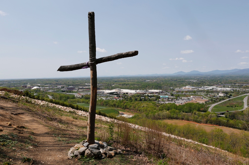 Cross overlooking a mountain
