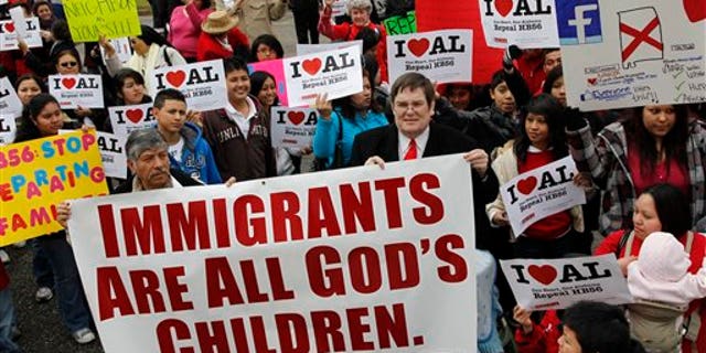 Opponents of Alabama's immigration law gather for a rally outside the Statehouse in Montgomery, Alabama.