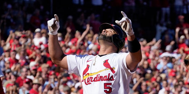 St. Louis Cardinals' Albert Pujols celebrates after hitting a solo home run during the third inning of a baseball game against the Pittsburgh Pirates Sunday, Oct. 2, 2022, in St. Louis. 