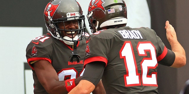 Antonio Brown of the Buccaneers celebrates a touchdown against the Atlanta Falcons with Tom Brady on Jan. 3, 2021, in Tampa, Florida.