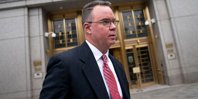 FILE - Timothy Shea exits Manhattan federal court after his court case was declared a mistrial on June 7, 2022, in New York. The Colorado businessman returns to New York on Monday, Oct. 24, 2022, for a retrial on charges that he cheated thousands of donors to a $25 million online crowdfunding "We Build The Wall" campaign to build a wall along the southern U.S. border. (AP Photo/John Minchillo, File)