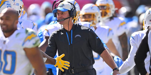 Chargers head coach Brandon Staley celebrates with the team after Los Angeles scored a touchdown against the Cleveland Browns, Sunday, Oct. 9, 2022.