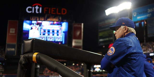 Manager Buck Showalter #11 of the New York Mets looks on from the dugout during the Wild Card Series game between the San Diego Padres and the New York Mets at Citi Field on Saturday, Oct. 8, 2022 in New York, New York.