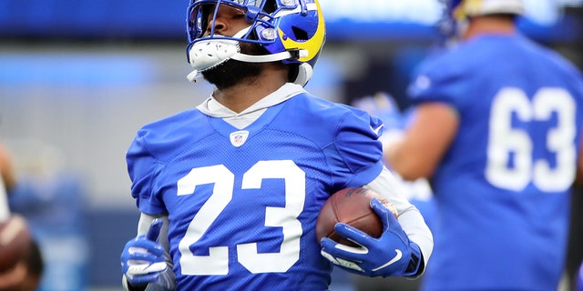 Cam Akers of the Los Angeles Rams runs with the ball during a practice at SoFi Stadium June 10, 2021, in Inglewood, Calif.