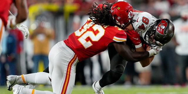 Kansas City Chiefs linebacker Nick Bolton tackles Tampa Bay Buccaneers tight end Cameron Brate during the game on Sunday at Raymond James Stadium in Tampa, Florida.