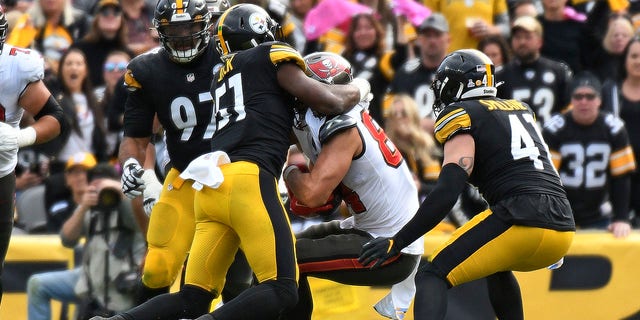 Cameron Brate was injured on the play and taken off the field on a cart.