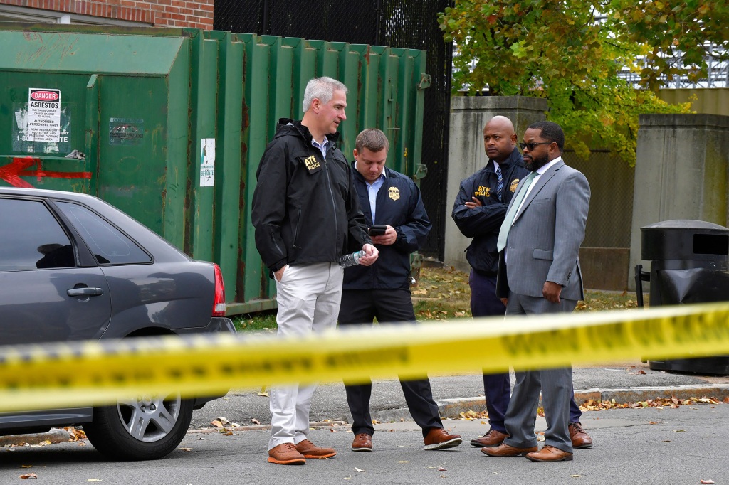 Alcohol, Tobacco, and Firearms agents stand outside the north side of the Central Visual and Performing Arts High School after a shooting that left three people dead including the shooter in St Louis, Missouri on October 24, 2022.