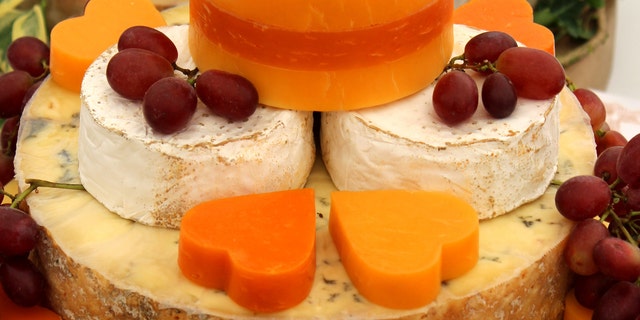 A selection of cheeses. Aged cheeses such as blue, feta, Parmesan or cheddar cheese are among the most common reported triggers of migraines, according to a study. 